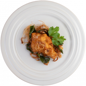 herb-fried-chicken-white-plate-wooden-floor