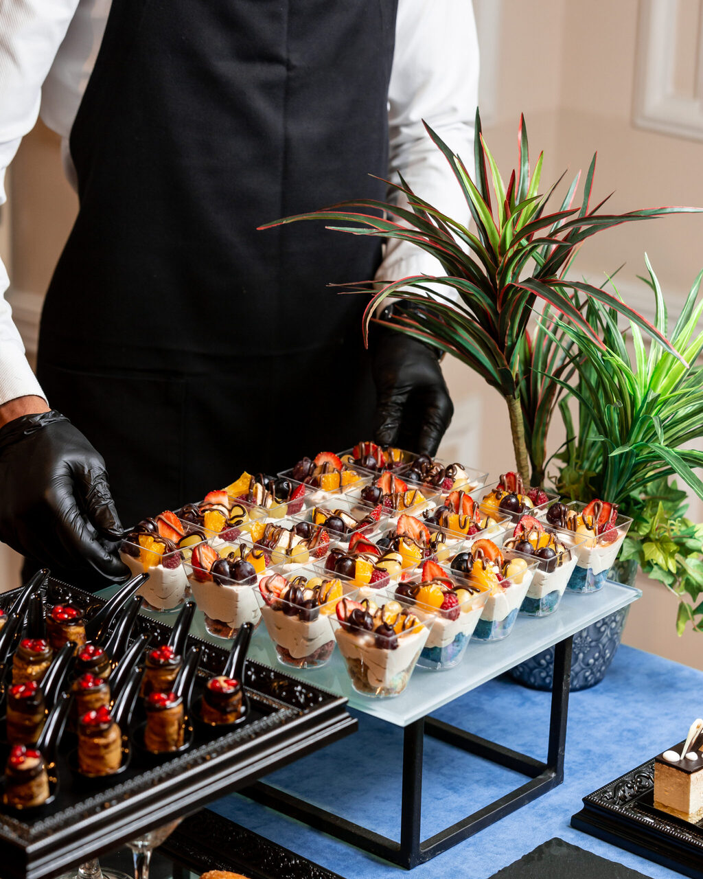 Chef plating a signature South Asian dish