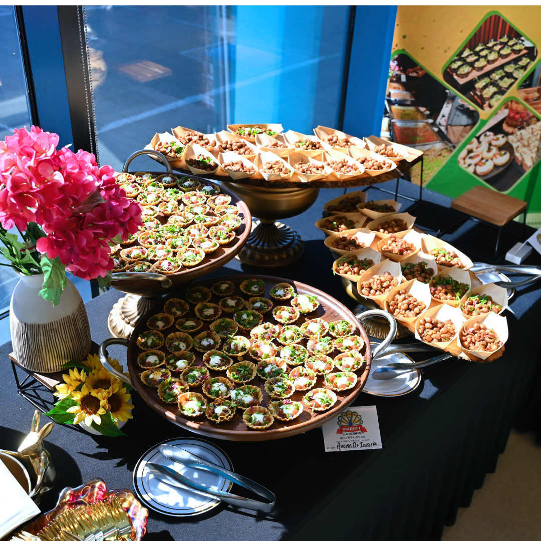 Catering table laid with platters and flowers