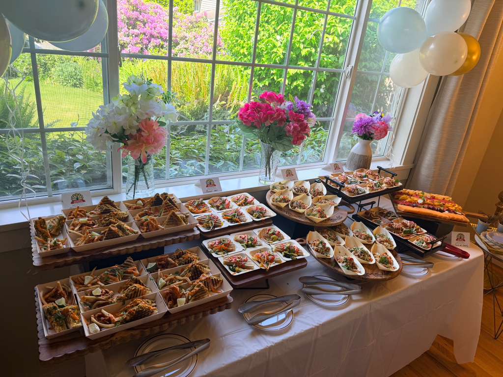 Server carrying a tray of canapes at a catered event