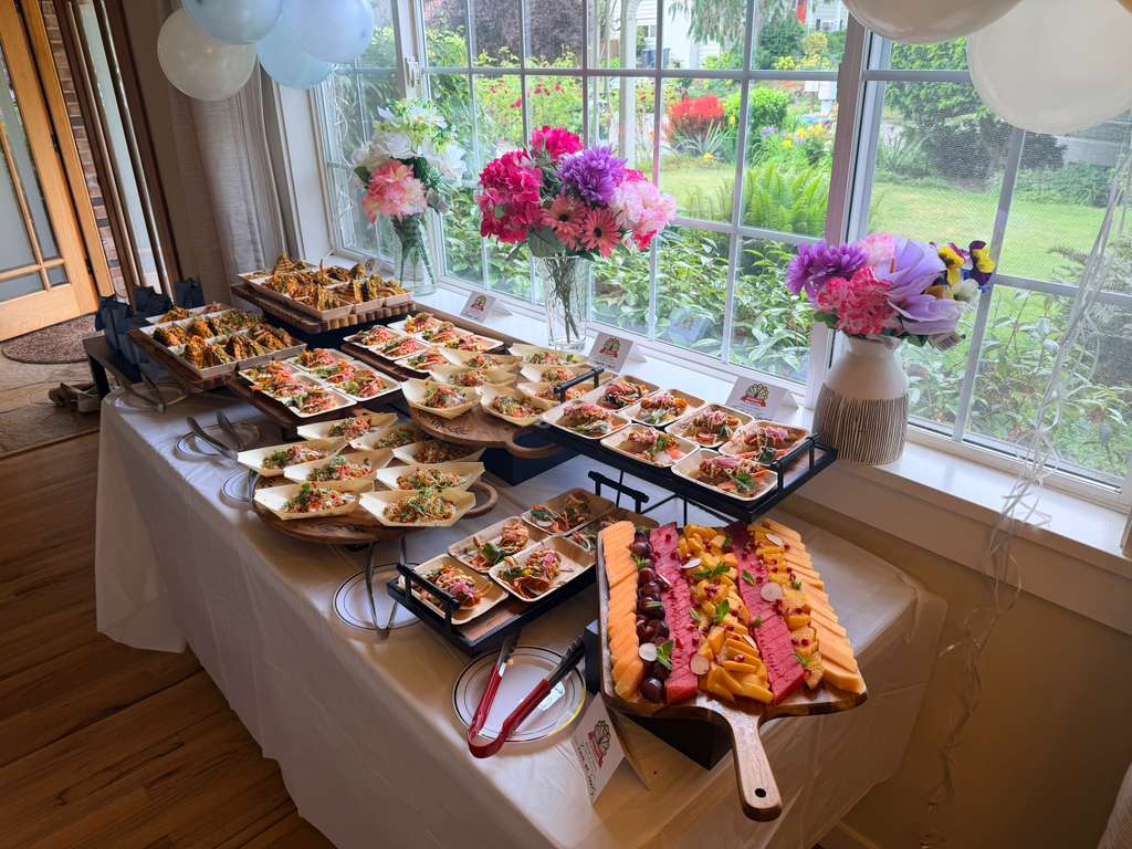 Server carrying a tray of canapes at a catered event